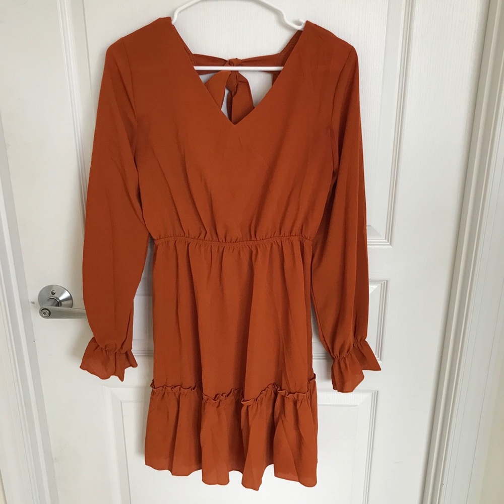 Burnt orange long sleeve open back dress
